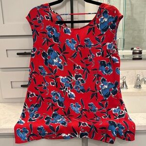 Gorgeous red sleeveless blouse with navy and blue flowers.